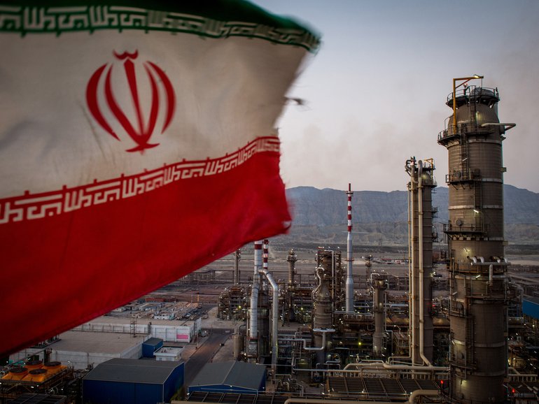 The Iranian flag flies at the Persian Gulf Star gas refinery in Bandar Abbas.