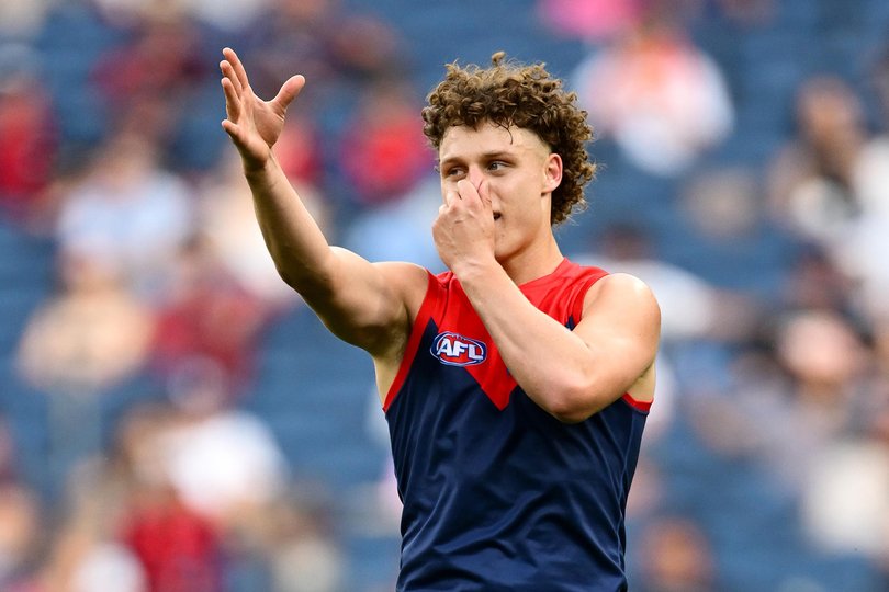 Koltyn Tholstrup of the Demons celebrates kicking a goal.