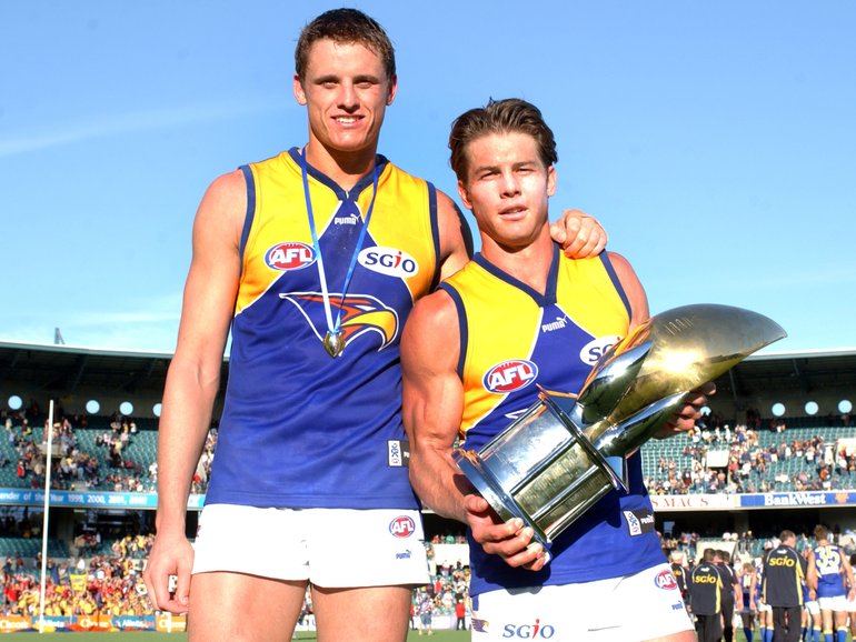 Michael Gardiner with the Ross Glendinning medal and captain Ben Cousins after the round five derby with the Fremantle Dockers at Subiaco Oval in 2003.