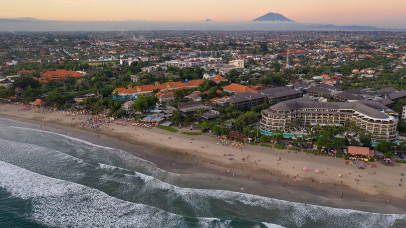 An Australian man has died after being found on a hotel balcony in Bali. 