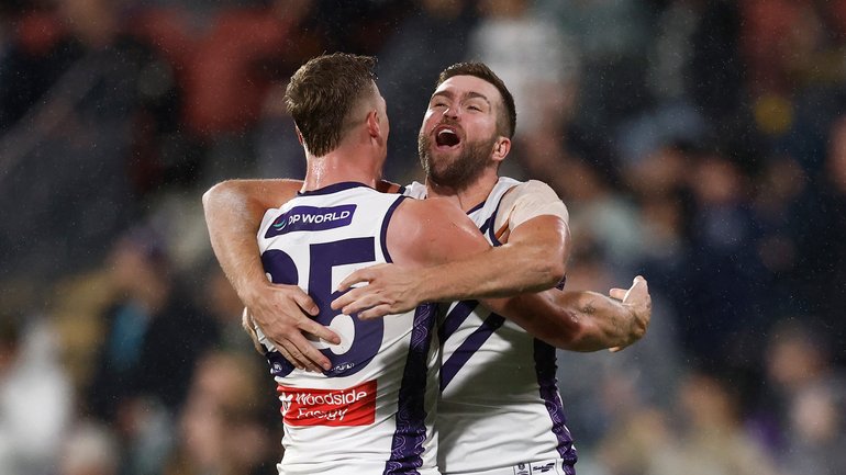 Josh Treacy (left) and Luke Ryan of the Dockers celebrate the win.