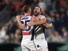 Josh Treacy (left) and Luke Ryan of the Dockers celebrate the win.