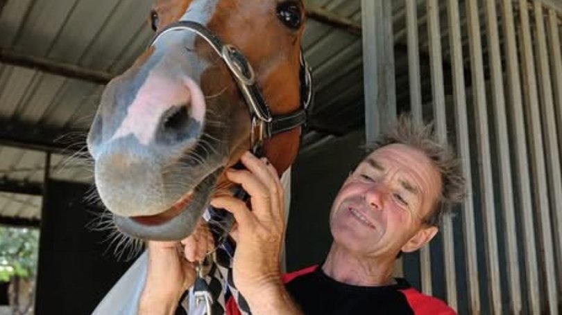 Queensland jockey Shane McGovern is in an induced coma in Townsville Hospital after he was trapped underneath a dead horse.