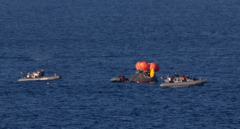 NASA’s Orion spacecraft is seen as recovery teams work to secure the spacecraft.