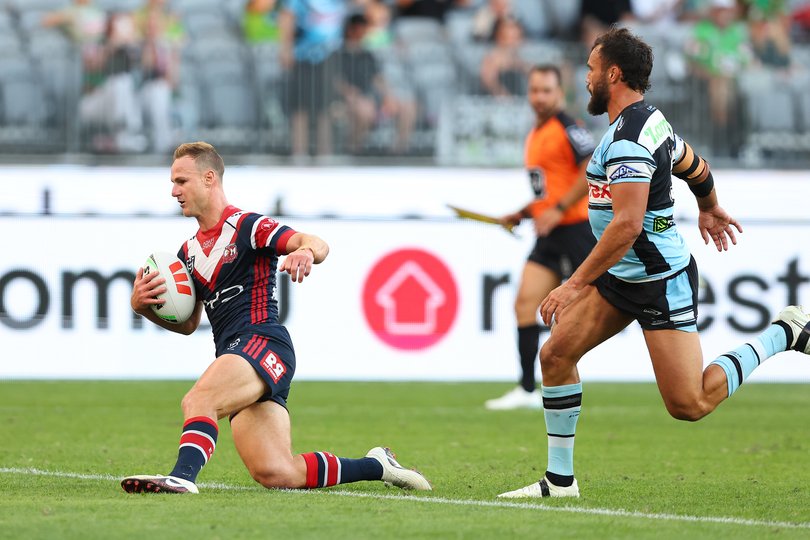 Daly Cherry-Evans of the Roosters crosses for a try.