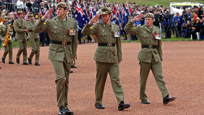Corporal Ben Roberts-Smith, VC, MG (left), Corporal Daniel Keighran, VC and Corporal Mark Donaldson, VC march past the saluting dais at the National ANZAC Day ceremony in Canberra, 2014.