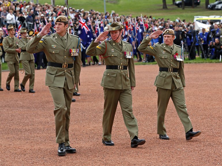 Corporal Ben Roberts-Smith, VC, MG (left), Corporal Daniel Keighran, VC and Corporal Mark Donaldson, VC march past the saluting dais at the National ANZAC Day ceremony in Canberra, 2014.