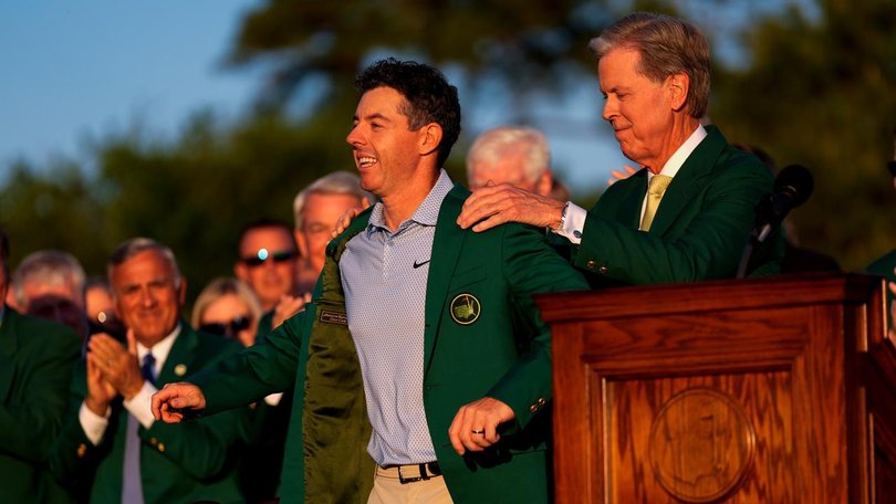 Rory McIlroy receives his second Masters green jacket from Masters chairman Fred Ridley. (AP PHOTO)