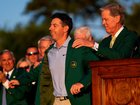Rory McIlroy receives his second Masters green jacket from Masters chairman Fred Ridley. (AP PHOTO)