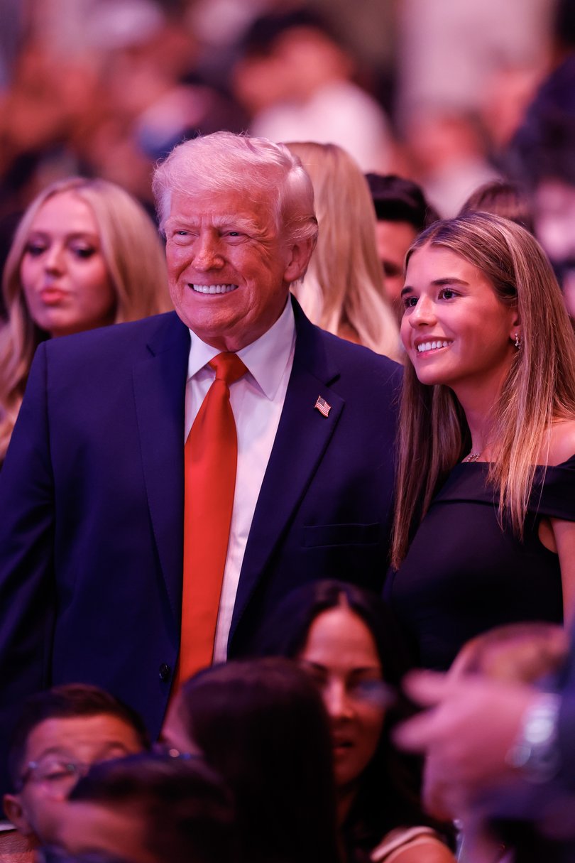 Donald Trump poses for a photo with his granddaughter, Kai Trump, during UFC 327 at the Kaseya Center.