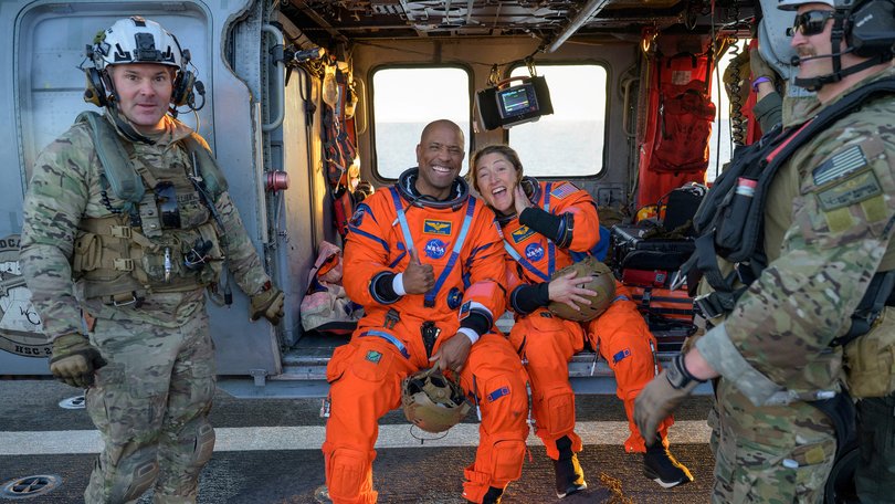 Victor Glover and Christina Koch on the flight deck of USS John P. Murtha.