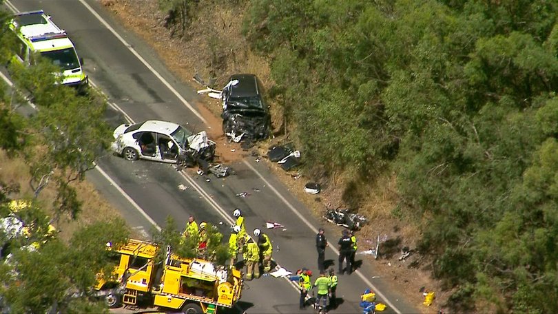 Emergency crews at Tamborine Mountain Rd after the crash.
