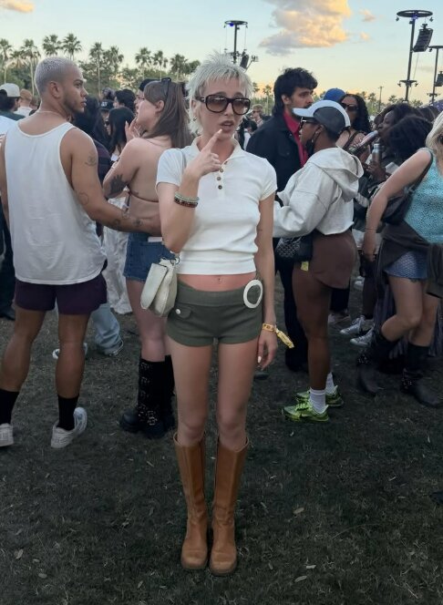 Fashion star Emma Chamberlain revealed her chilled-out Coachella outfits featuring mini shorts, boots, and statement glasses.