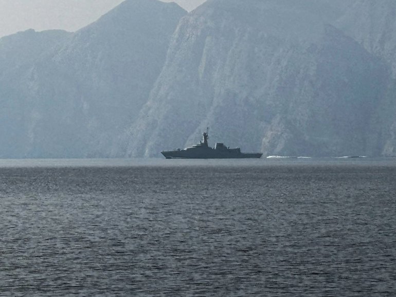 A navy vessel is seen sailing in the Strait of Hormuz.