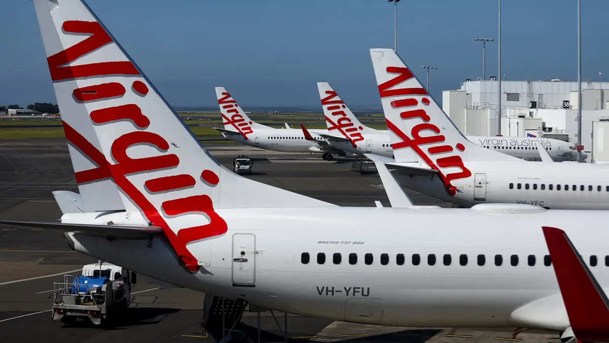 Virgin Australia follows Qantas with fare hikes, fewer flights as it battles jet fuel costs amid Mid East war