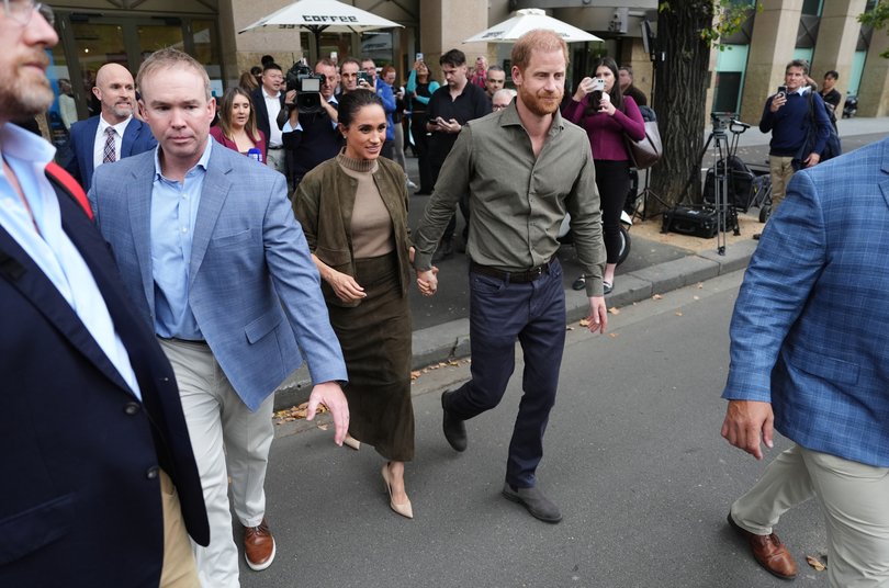 Prince Harry, Duke of Sussex and Meghan, Duchess of Sussex leave the Australian National Veterans Arts Museum.