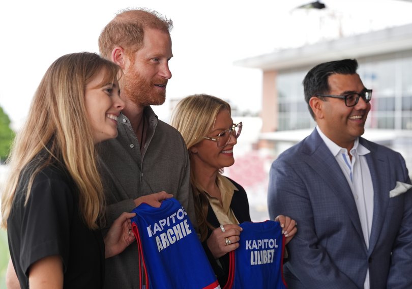 The Duke of Sussex is presented with Western Bulldogs Archie and Lilibet jerseys.