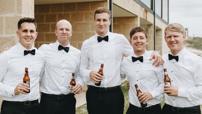 Jaryd (second left) at Jordan’s (middle) wedding in 2024. 