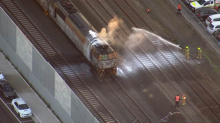 Sydney train services have been disrupted during peak hour after a freight train carriage caught fire.