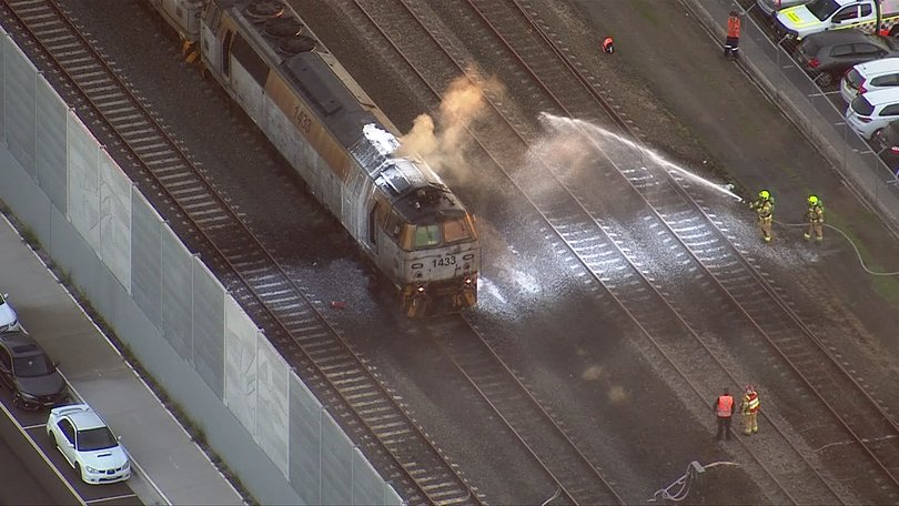 Sydney train services have been disrupted during peak hour after a freight train carriage caught fire.