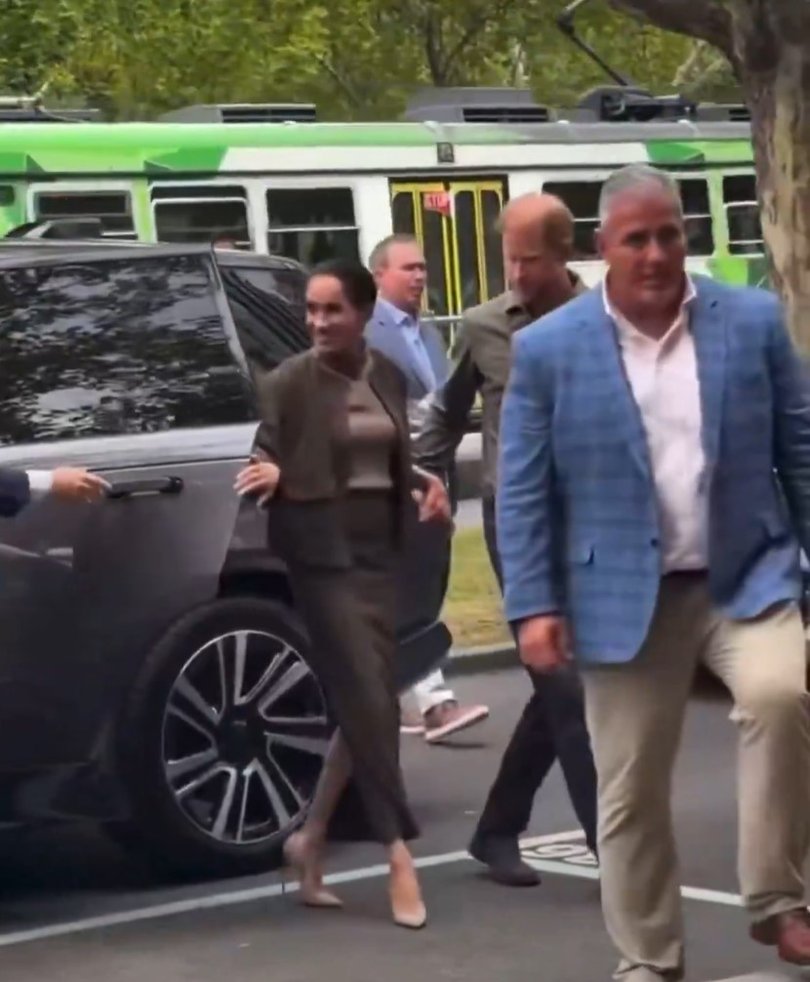 Prince Harry was seen opening a car door for Meghan Markle during their Australian tour.