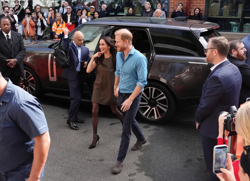 Meghan, Duchess of Sussex, and Prince Harry, Duke of Sussex arrive for a visit to batry Australia, a mental health engagement program at Swinburne University of Technology.