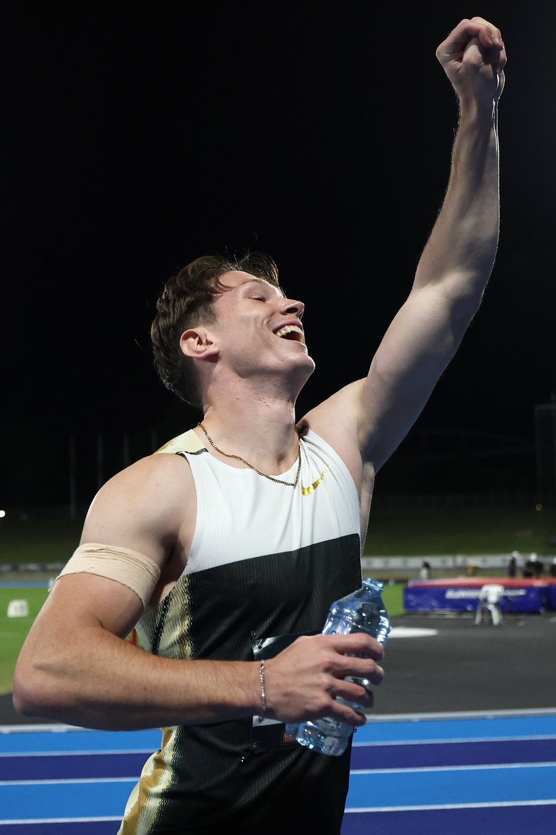 Lachlan Kennedy of Queensland celebrates after winning the Men's 100m Final.