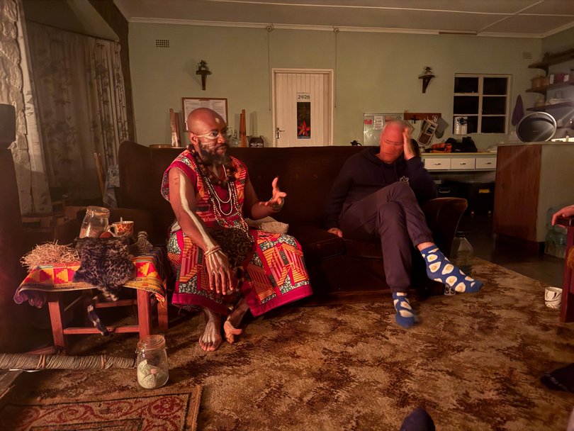 Journalist Adam Shand with traditional healer Lewis Mbwela. Mbwela had a long struggle with alcohol before beginning his journey with iboga three years ago. 