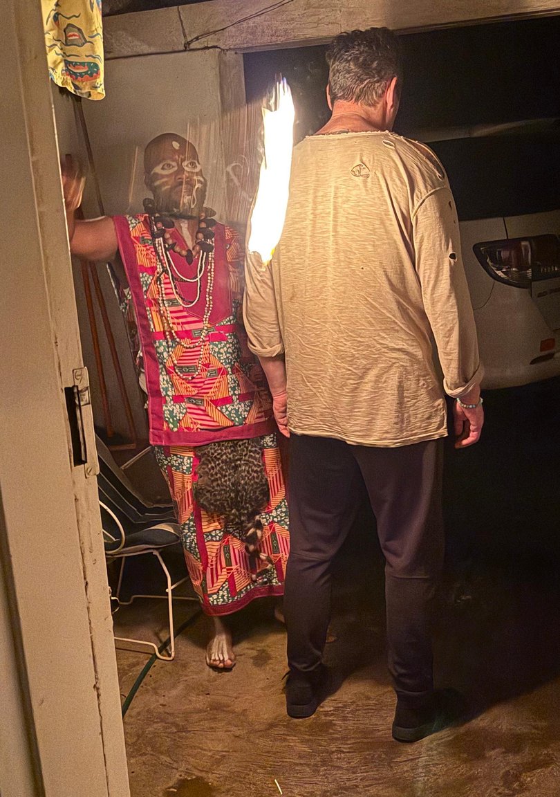 Journalist Adam Shand with traditional healer Lewis Mbwela. 