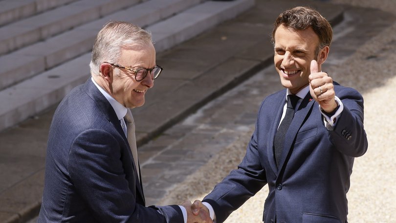 French President Emmanuel Macron, right, and Australian Prime Minister Anthony Albanese shake hands after addressinf reporters Friday, July 1, 2022 at the Elysee Palace in Paris. Australia and France opened a "new chapter" in relations as the new Australian prime minister seeks to heal wounds caused by a secret submarine contract that infuriated France. (AP Photo/ Thomas Padilla)