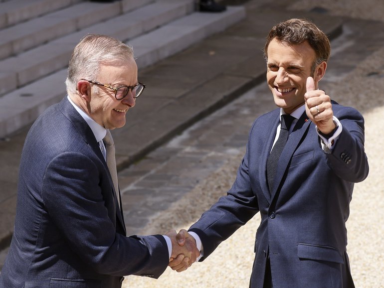 French President Emmanuel Macron, right, and Australian Prime Minister Anthony Albanese shake hands after addressinf reporters Friday, July 1, 2022 at the Elysee Palace in Paris. Australia and France opened a "new chapter" in relations as the new Australian prime minister seeks to heal wounds caused by a secret submarine contract that infuriated France. (AP Photo/ Thomas Padilla)