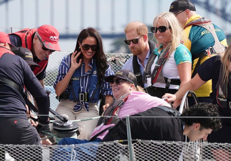 The couple take part in a sailing event with members of Invictus Australia.