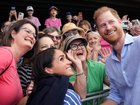 Prince Harry and Meghan take a selfie with well-wishers at a sailing event with members of Invictus Australia in Sydney Harbour, on day four of the royal trip on April 14, 2026.