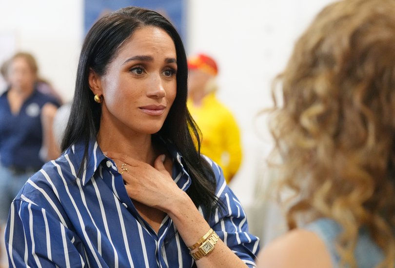 Meghan Markle meets volunteer first responders from the Bondi Surf Bathers' Life Saving Club during a visit to Bondi Beach. 
