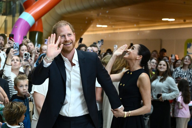 Prince Harry and Meghan greet children during their visit to the Royal Children’s Hospital in Melbourne. 