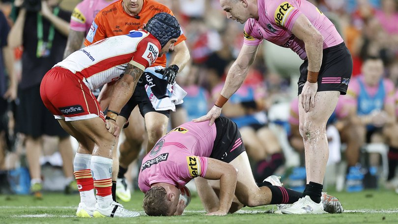 Mitch Kenny of the Panthers reacts in pain after being tackled by Kodi Nikorima.