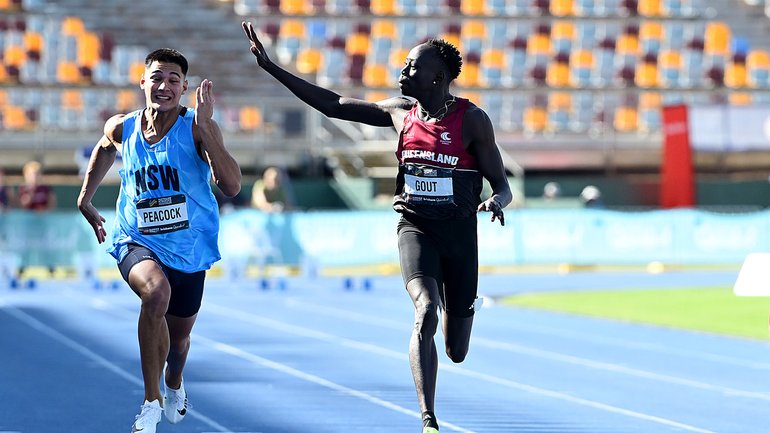 Gout Gout waves to family and friends as he celebrates victory.