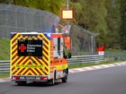 An ambulance leaves the track following a crash at the Nordschleife.