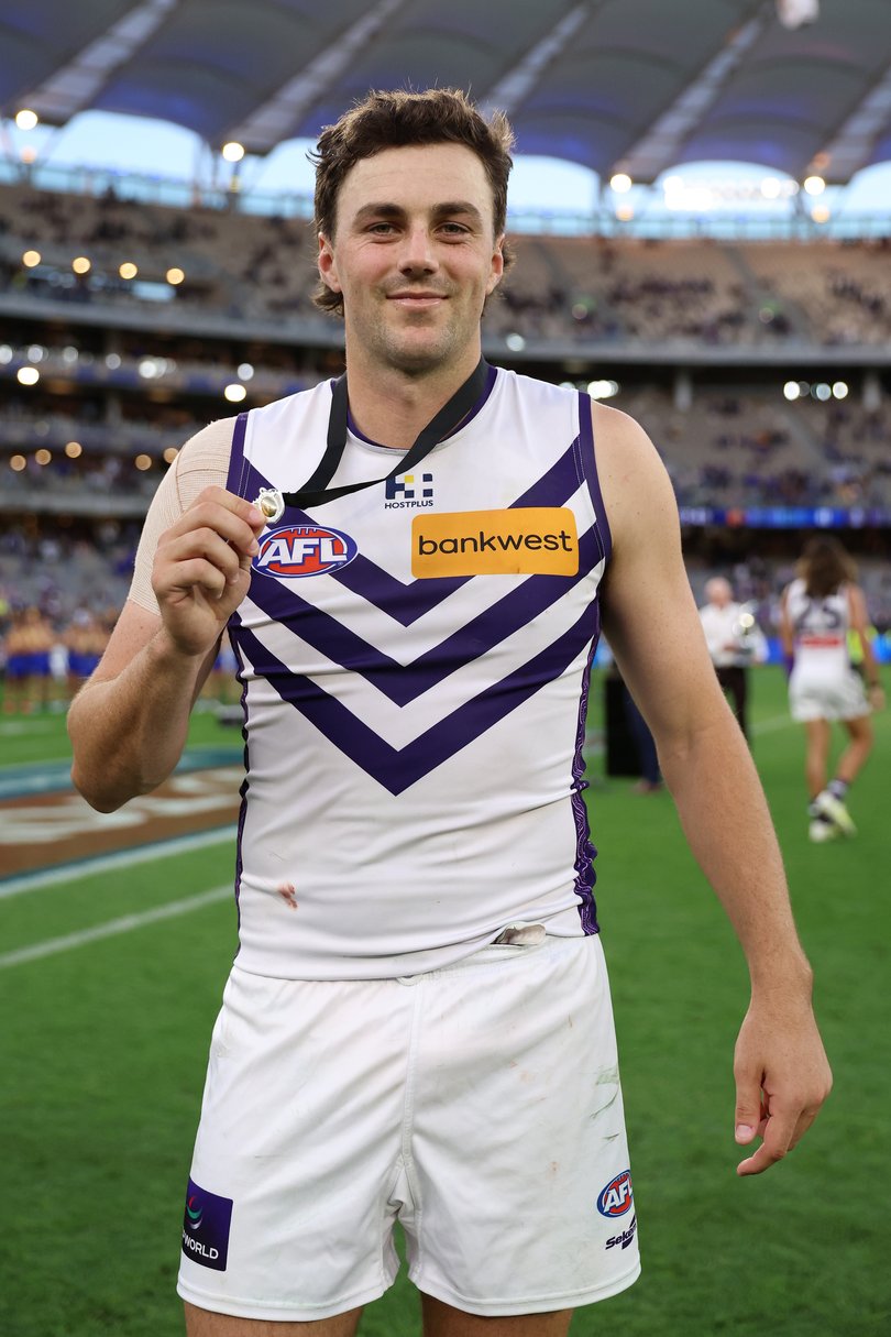 PERTH, AUSTRALIA - APRIL 19: Jordan Clark of the Dockers wins the Glendinning–Allan Medal during the round six AFL match between West Coast Eagles and Fremantle Dockers at Optus Stadium, on April 19, 2026, in Perth, Australia. (Photo by Janelle St Pierre/AFL Photos/via Getty Images)