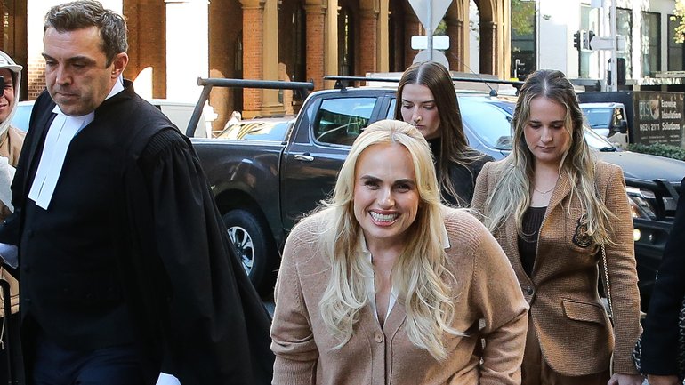 Rebel Wilson arrives at Federal Court with her legal team. 