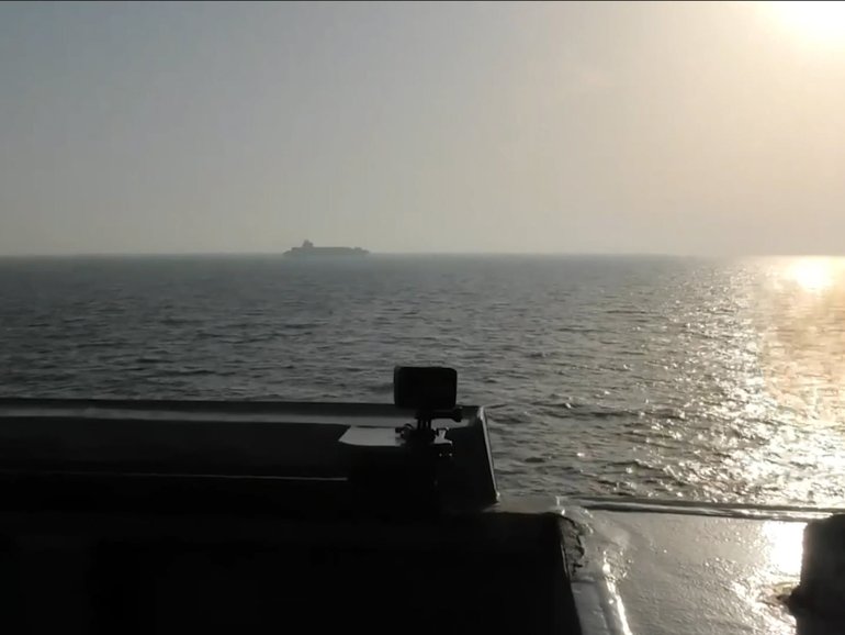 Guided-missile destroyer USS Spruance fires on the Touska.