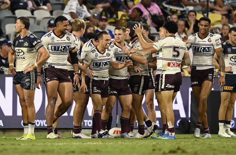 Luke Brooks celebrates after scoring a try against North Queensland.