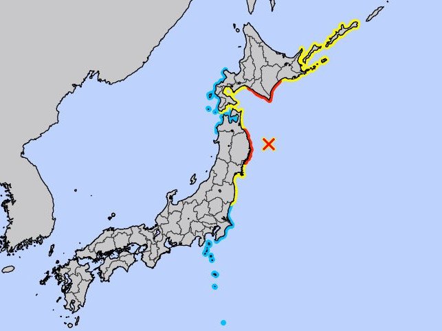 A map of Japan with red representing areas at high risk of the incoming tsunami while yellow is advisory.