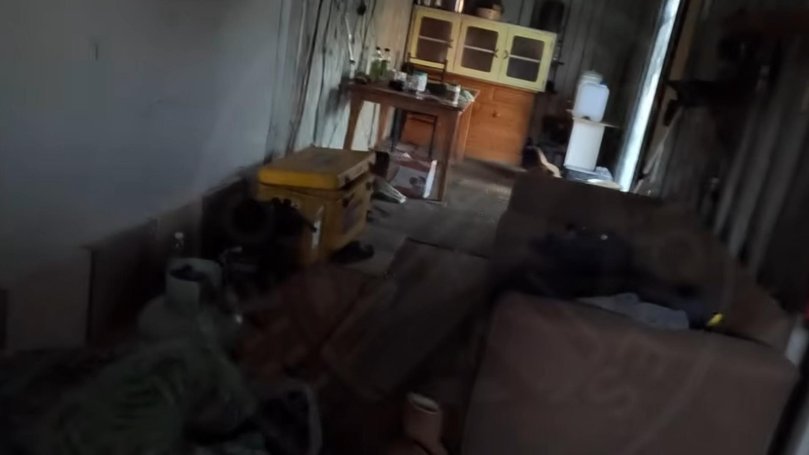 A gas bottle can be seen in the bottom left corner, as well as several multivitamin containers on a table. 