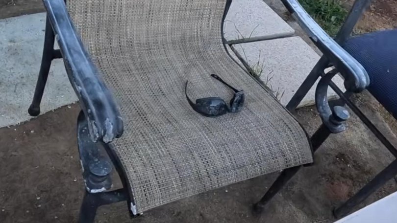 A pair of sunglasses can be seen on a chair. Picture: Supplied / YouTube