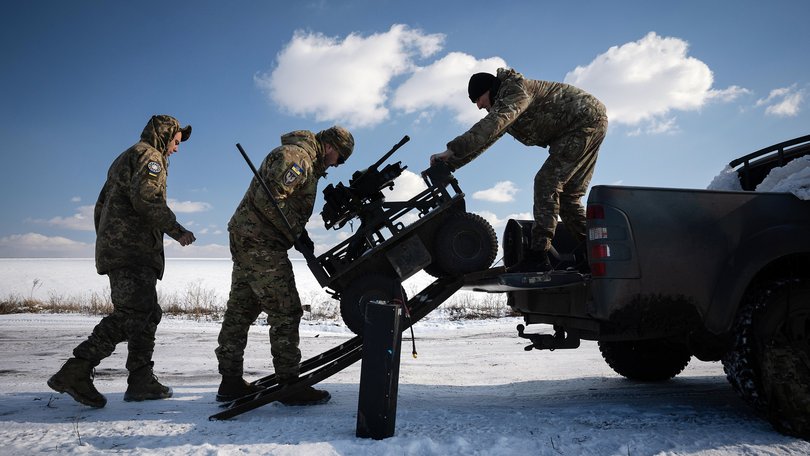 FILE — Ukrainian soldiers train with an unmanned ground vehicle in the Donbas region of eastern Ukraine, Feb. 21, 2025. Ukraine is using unmanned ground vehicles armed with bombs, guns or rockets to carry out attacks and keep its soldiers out of harm’s way. (Tyler Hicks/The New York Times)