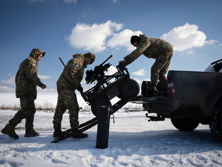 FILE — Ukrainian soldiers train with an unmanned ground vehicle in the Donbas region of eastern Ukraine, Feb. 21, 2025. Ukraine is using unmanned ground vehicles armed with bombs, guns or rockets to carry out attacks and keep its soldiers out of harm’s way. (Tyler Hicks/The New York Times)