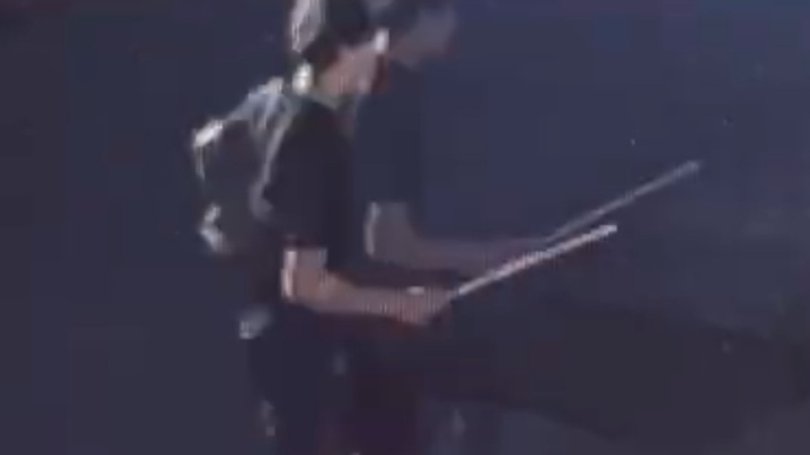 About six youth jumped out of a vehicle armed with metal poles and a machete as they chased down two males in Port Melbourne. Source: Supplied