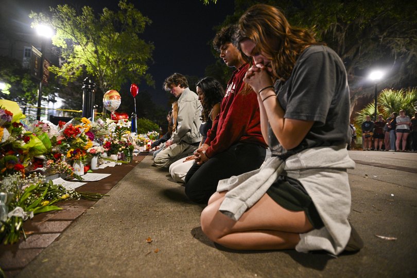 Students hold a vigil near the scene of a shooting near the Florida State University student centre on April 17, 2025 in Tallahassee, Florida.