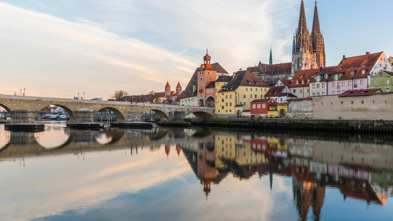 View of the Stone Bridge, St. Peter's Church and the Old Town of Regensburg, Germany.
